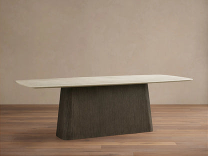 Saint Germain dining table: light cream stone top, rounded, with dark brown textured wood Toulouse base on a wood floor.
