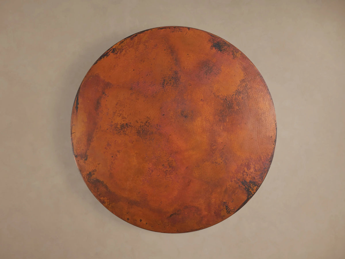 Close-up of the Recycled Metal Bistro Table's dark Wade base, featuring a wide round bottom and ornate fluted column.