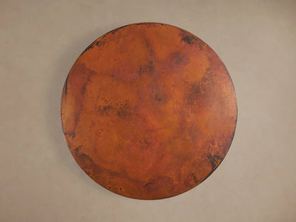 Close-up of the Recycled Metal Bistro Table's dark Wade base, featuring a wide round bottom and ornate fluted column.