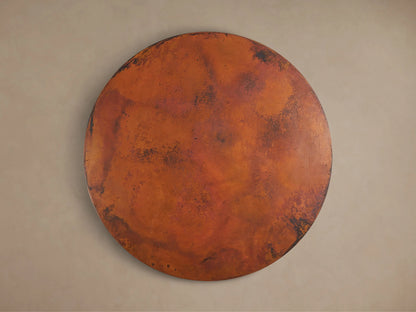 Recycled Metal Bistro Table with hammered copper top, warm orange and dark brown distressed patina. Intricate butterfly detail on edge.