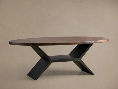 Recycled Metal Dining Table with Vertex Base featuring an oval copper top with dark, textured patina and black iron base.