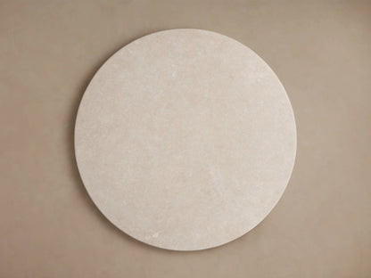 Round tabletop featuring cream marble with subtle veining and natural variations. The smooth surface has a polished finish.