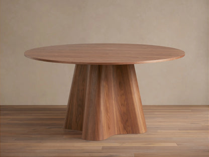 Round wooden dining table with a smooth top and a unique, flared pedestal base. Light brown finish on wood grain.