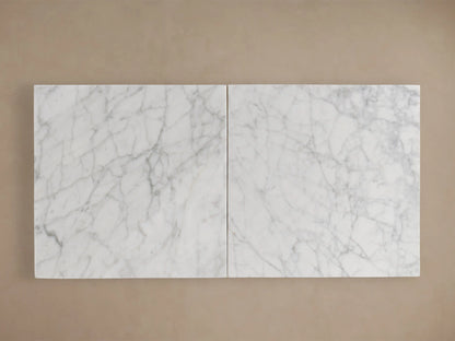 Oval Danae Stone Dining Table, white marble top with intricate grey veining, viewed from above on a warm beige background.
