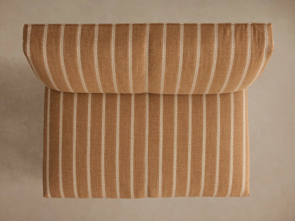 Eaton Bench, back 3/4 view, light brown fabric with thin white vertical stripes, dark tapered legs.
