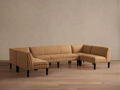 Eaton U-Shaped Banquette in light brown & white striped fabric, U-shaped, with dark tapered legs on a wood floor.