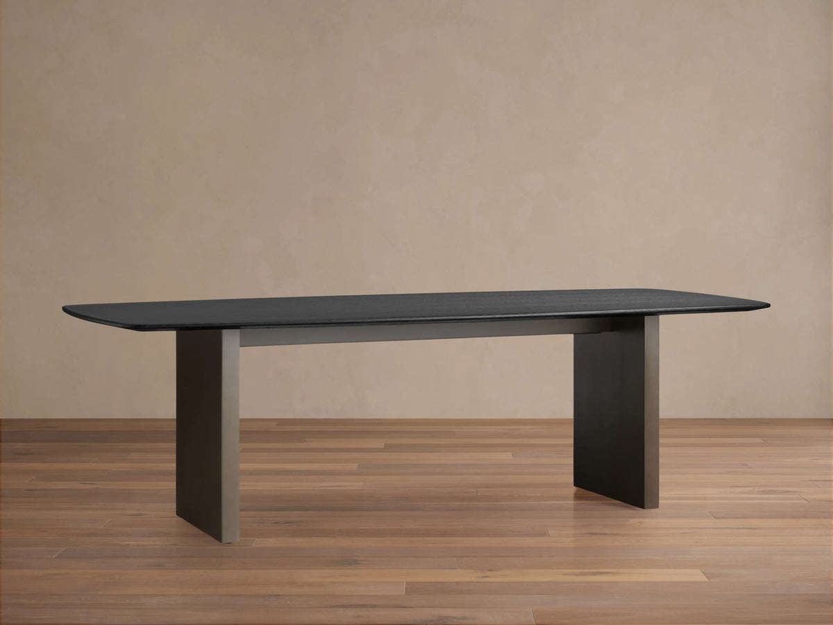 Dark wood tabletop of the Saint Germain Dining Table, featuring a smooth, rectangular surface with an ebony finish and visible grain.