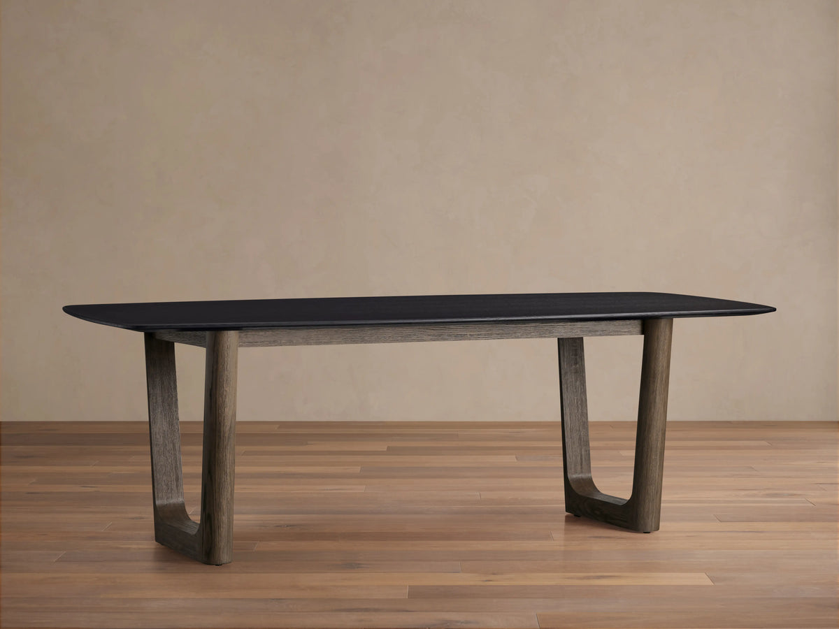 Saint Germain Wood Dining Table with dark oak top in Ebony finish, featuring a unique Rennes base in a warm wood tone.