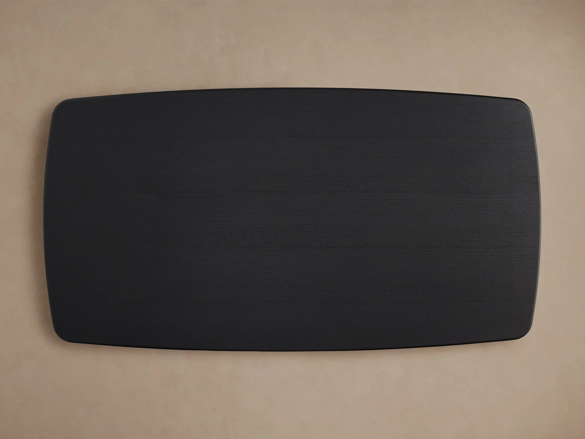Saint Germain dining table with ebony-finished oak wood top, showing smooth edges and subtle wood grain texture against a neutral background.