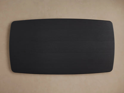 Saint Germain dining table with ebony-finished oak wood top, showing smooth edges and subtle wood grain texture against a neutral background.