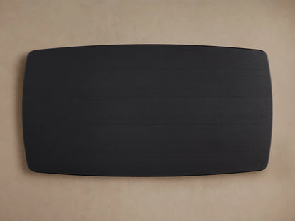 Saint Germain wood dining table top view, showing a smooth, rectangular ebony finish with rounded edges on a light background.
