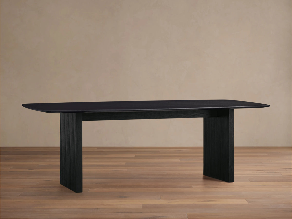 Top view of Saint Germain Dining Table with a sleek, rectangular wood top in a rich Ebony finish, showcasing visible grain texture.