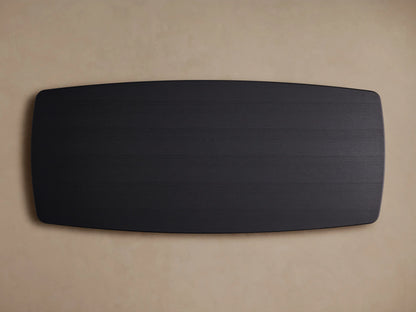 Saint Germain Wood Dining Table with Ebony finish, solid oak top, rounded edges, and dual Dauphine base on a wooden floor.