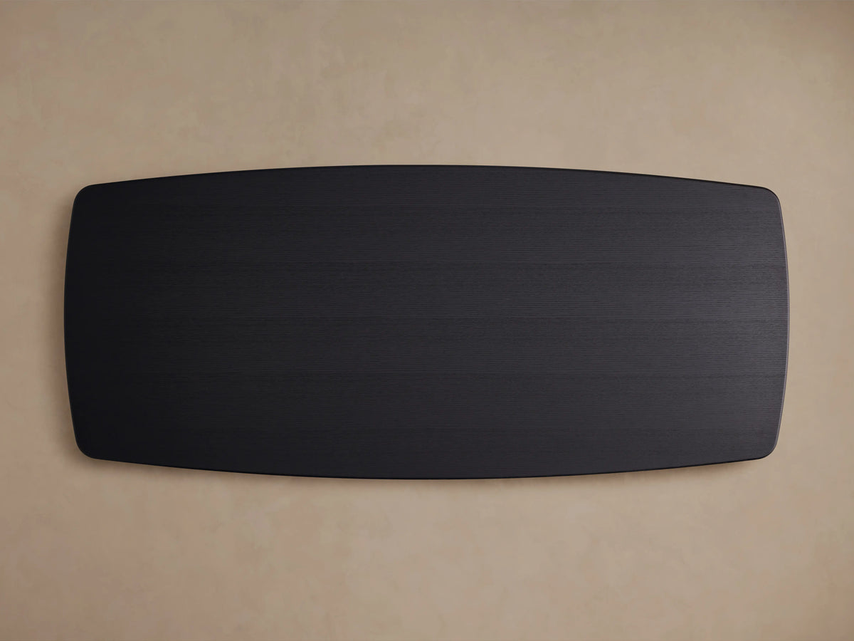 Top view of the Saint Germain Wood Dining Table's rectangular solid oak tabletop finished in Ebony, on a neutral background.
