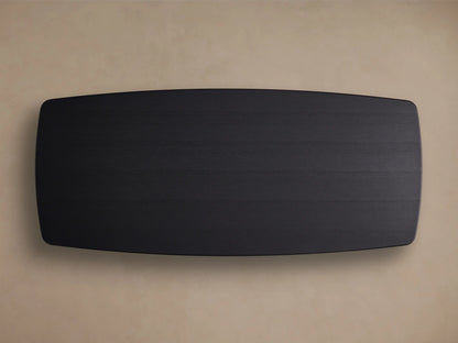 Close-up of Saint Germain Wood Dining Table corner. Ebony finish, dark wood grain texture, and rounded edge.
