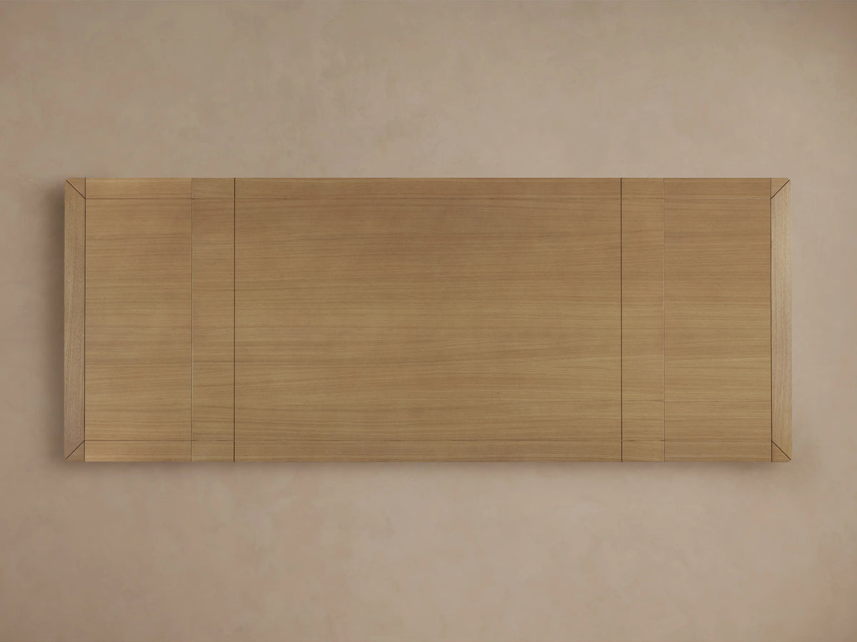 Eletta Dining Table, overhead view of light European white oak tabletop with horizontal grain and darker framed end sections.