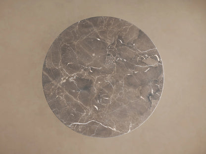 Saint Germain Counter Table with espresso brown marble top, visible white veining. Golden steel base with smooth, rounded design.