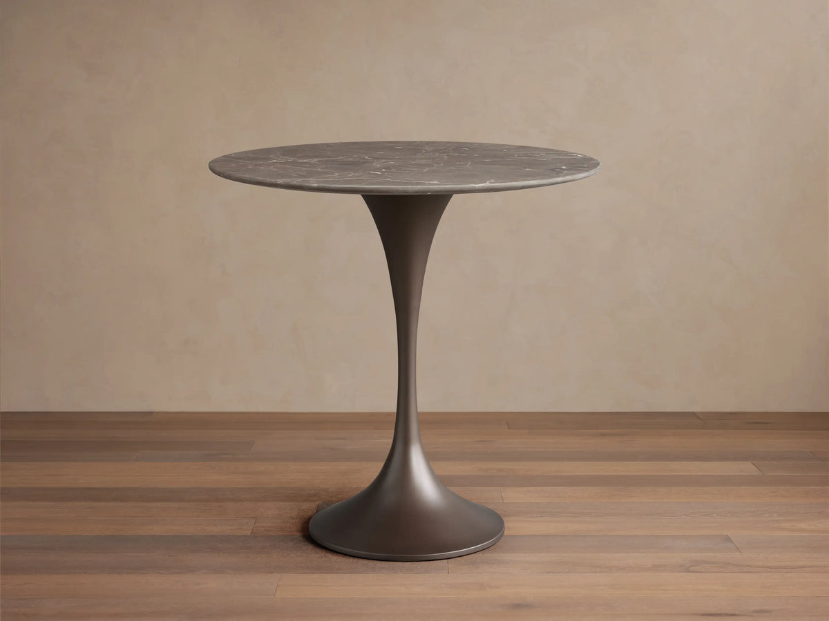 Saint Germain Bistro Table with espresso brown stone top, featuring natural veining patterns, and a sleek steel base.