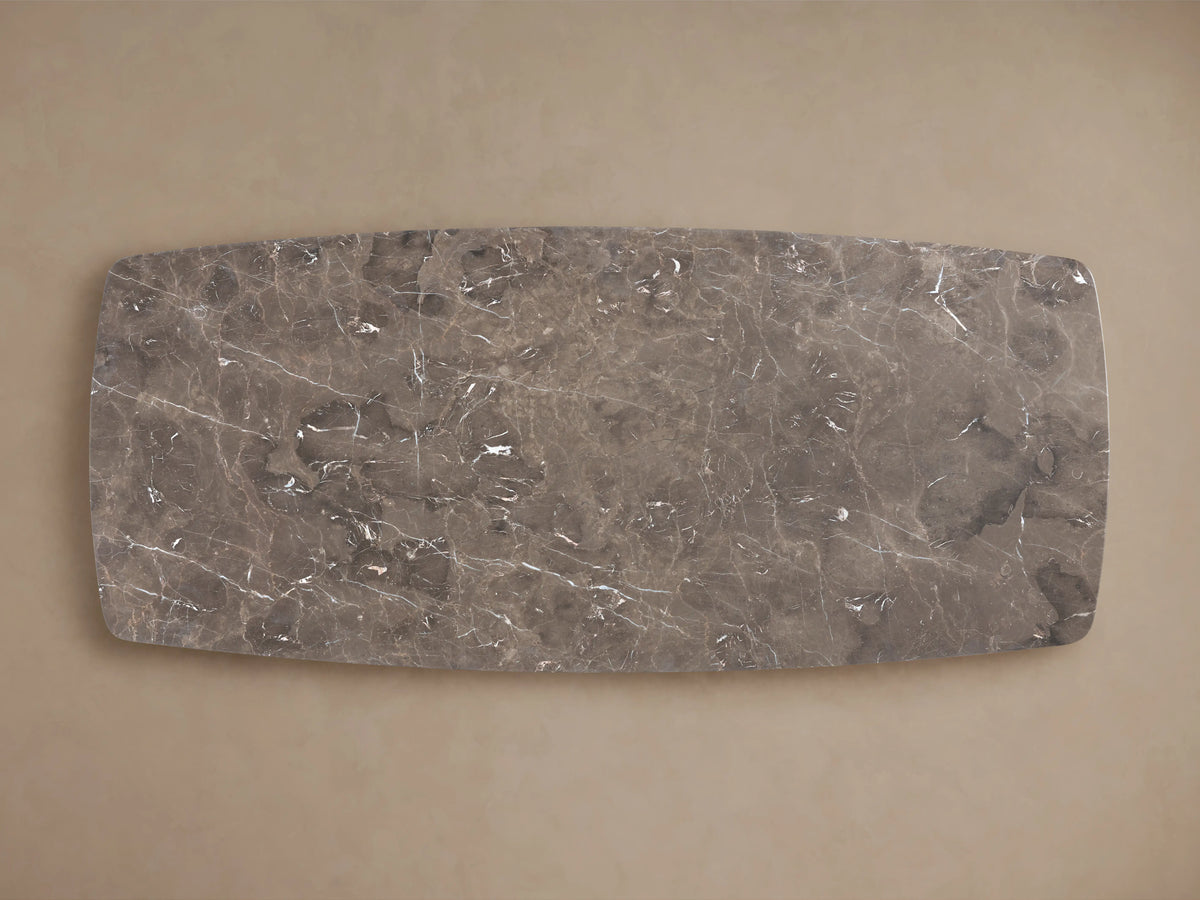 Stone dining tabletop made of espresso brown marble with visible veining and natural variations, viewed from above.