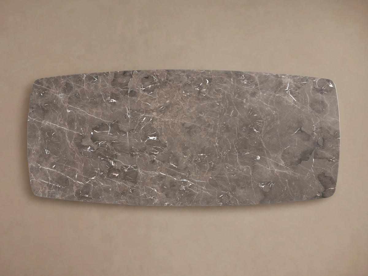 Stone dining table top in espresso brown, showing rich veining and natural variations. Table surface has a smooth, lustrous finish.