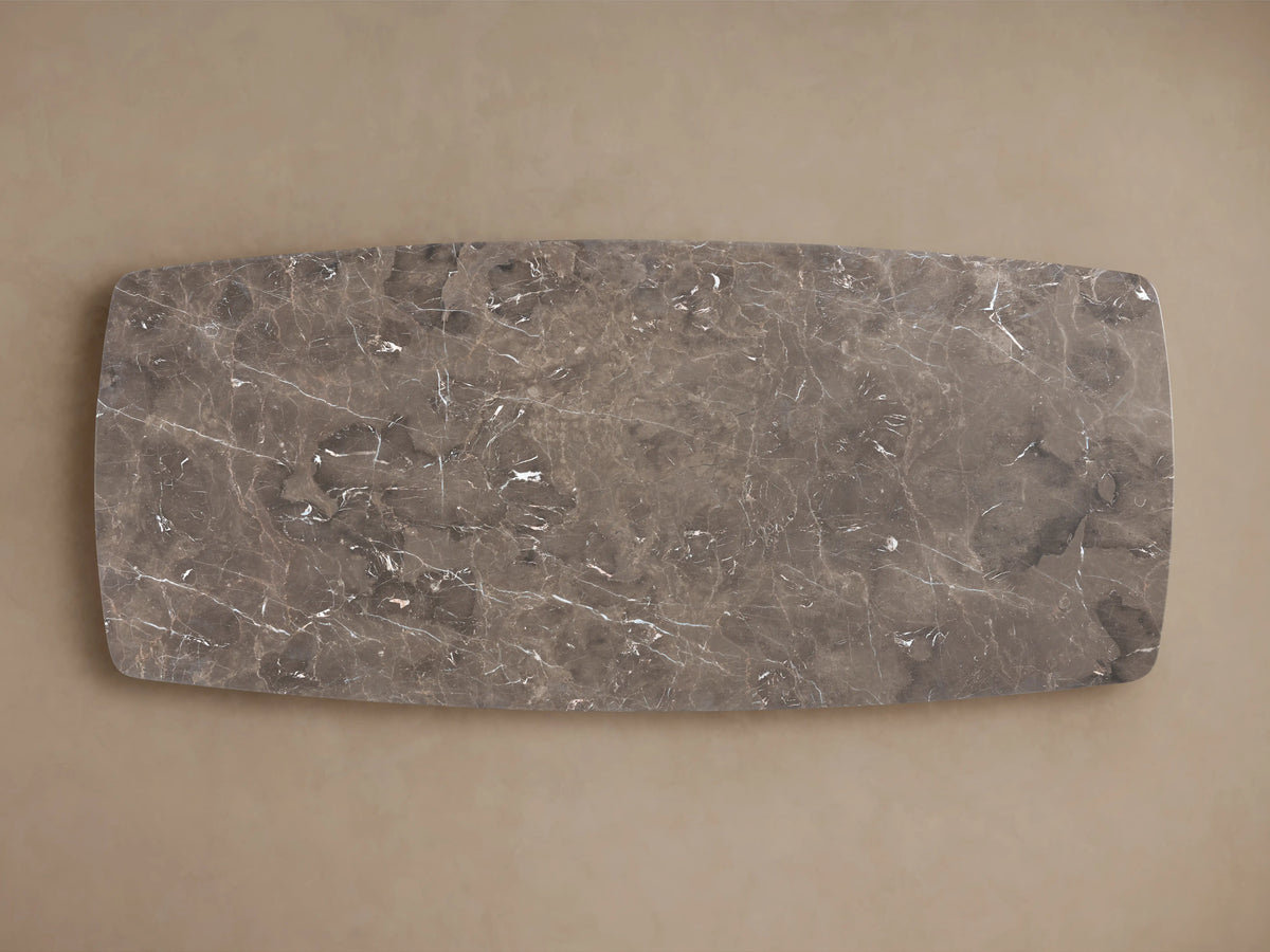 Espresso brown stone tabletop with natural veining and mineral deposits, showing rounded edges and smooth finish.