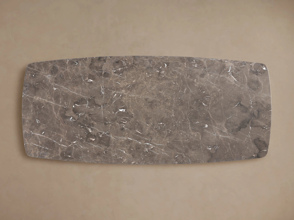 Rectangular stone tabletop with a natural pattern and veins, featuring a smooth, glossy finish atop a neutral background.
