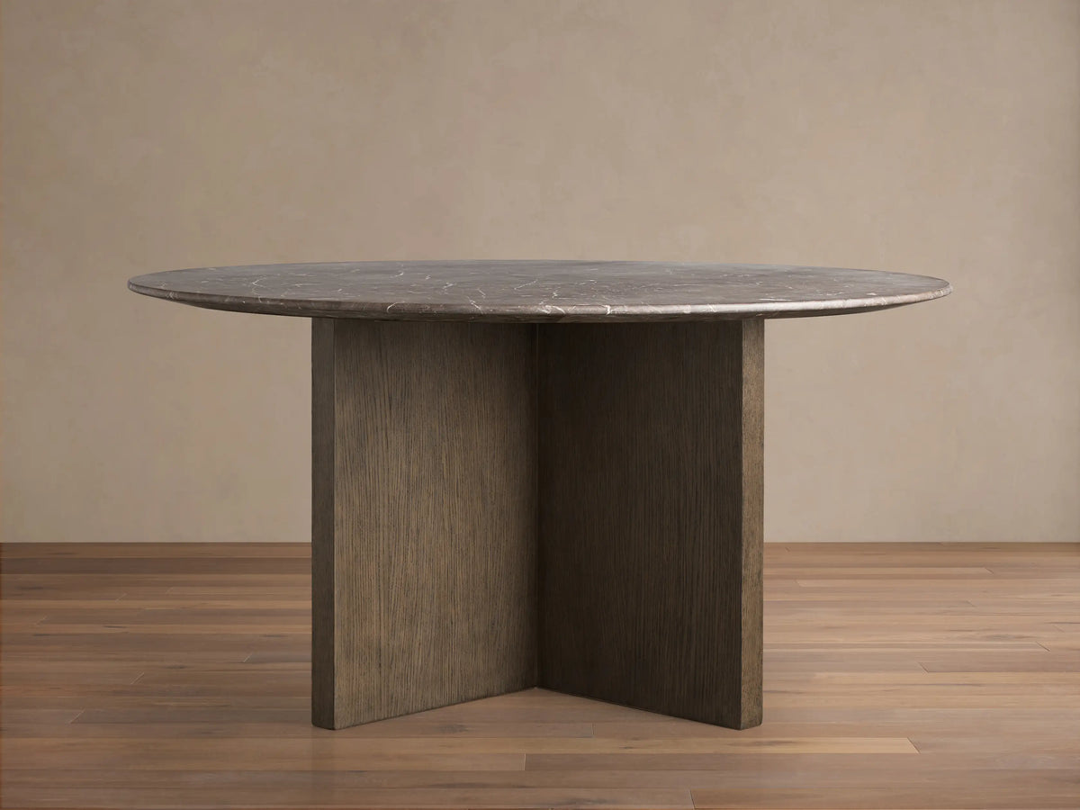 Front view of the Saint Germain Round Stone Top Dining Table with an espresso brown stone top and dark wood Clement Base.