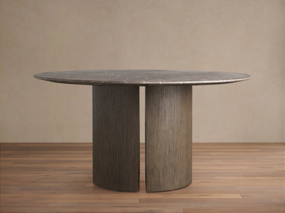 Saint Germain Round Stone Dining Table with a dark marble top and a dark wooden Dauphine base, featuring a split cylindrical design.