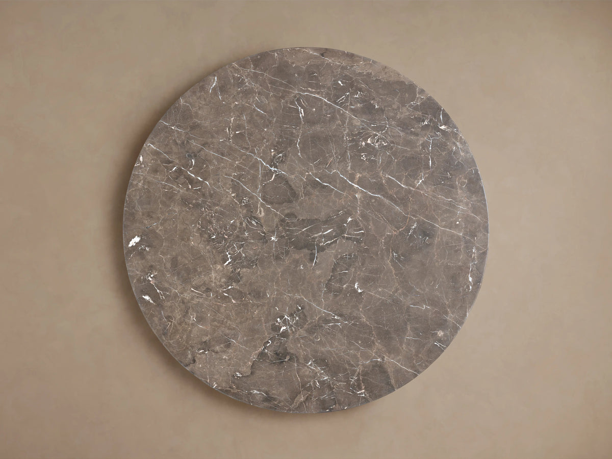 Saint Germain Round Stone Dining Table, close-up of dark brown marble top with intricate white and reddish natural veining.
