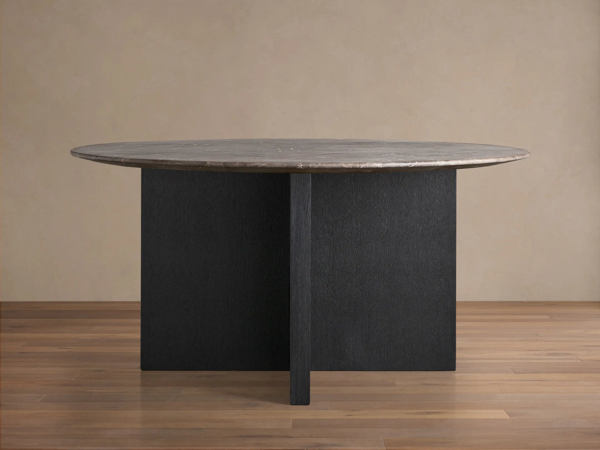 Front view of the espresso brown Saint Germain Round Stone Top Dining Table with Ebony Wood Clement Base.