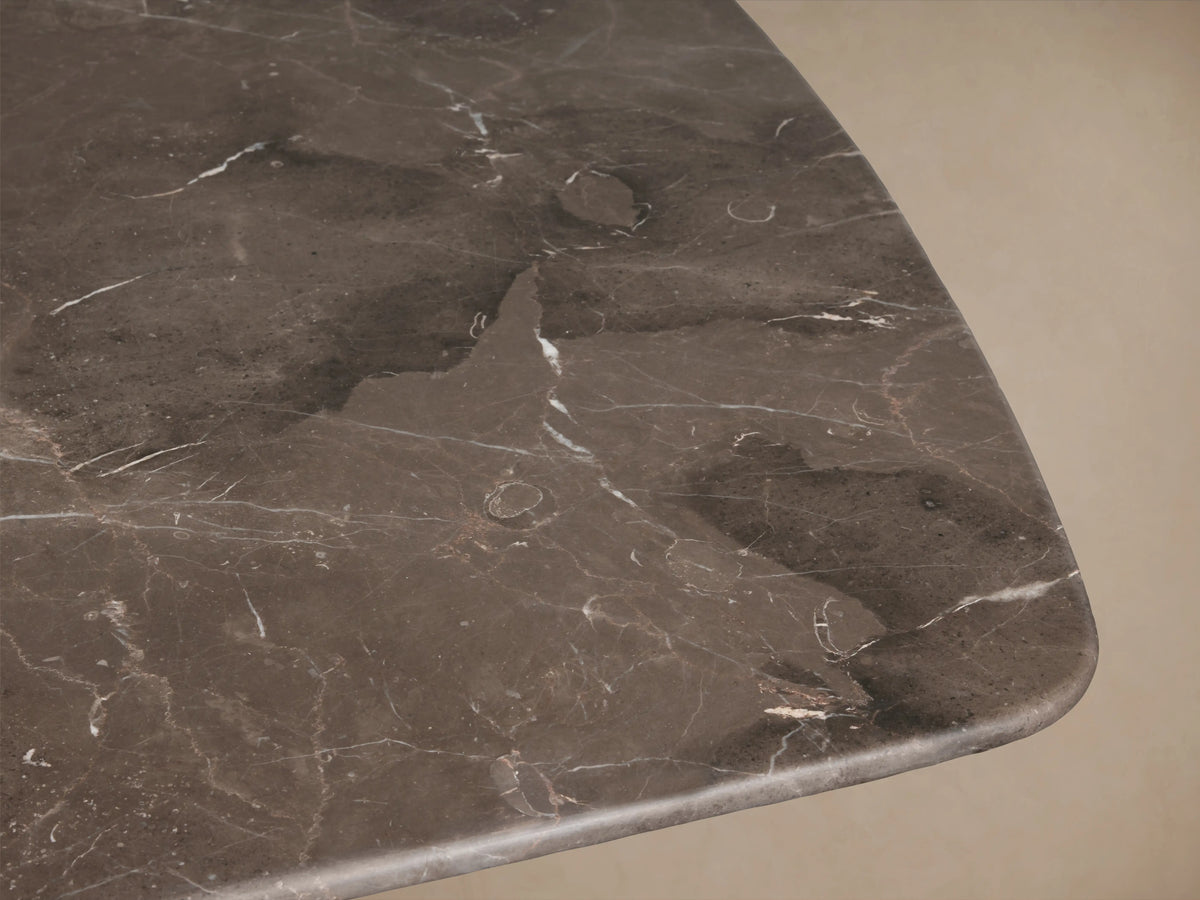 Close-up of the Saint Germain Stone Dining Table top, featuring espresso brown marble with natural veining and smooth finish.