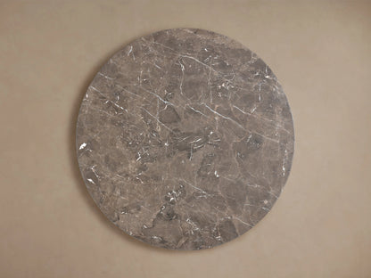 Round tabletop of the Saint Germain Dining Table in espresso brown stone, showcasing unique veining and natural mineral patterns.
