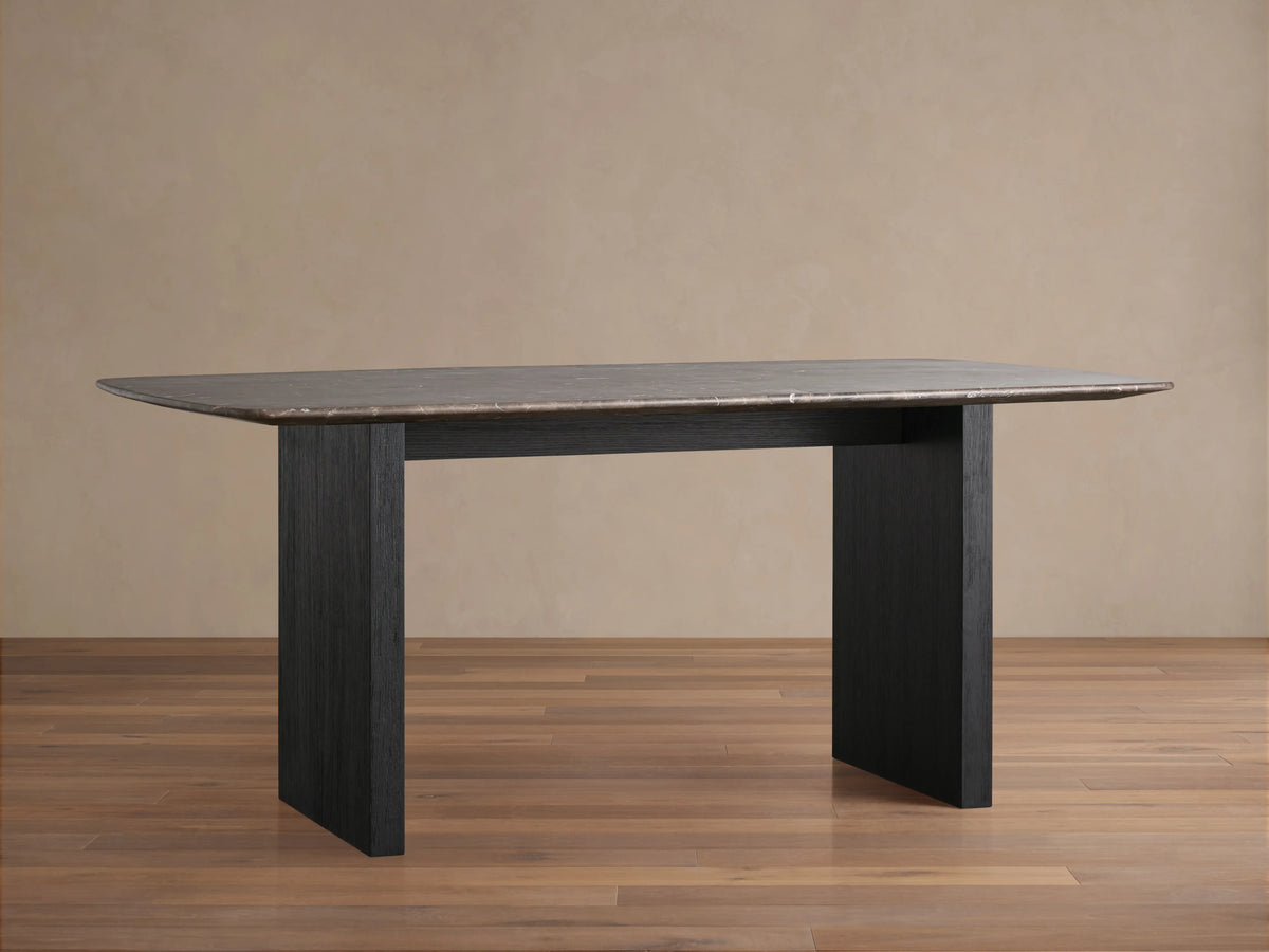 Corner of the Saint Germain Stone Top Dining Table showing espresso brown stone with natural veining and subtle texture.
