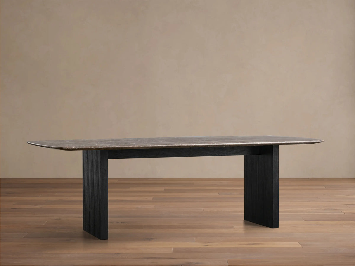 Front view of the Saint Germain Stone Top Dining Table with an espresso brown stone top and ebony Wood Clement Base.