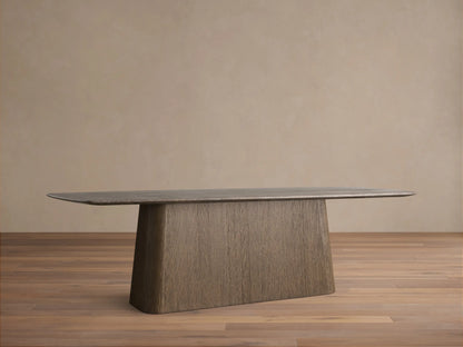 Saint Germain Stone Dining Table with espresso brown stone top and dark oak veneer pedestal base, on a wood floor.