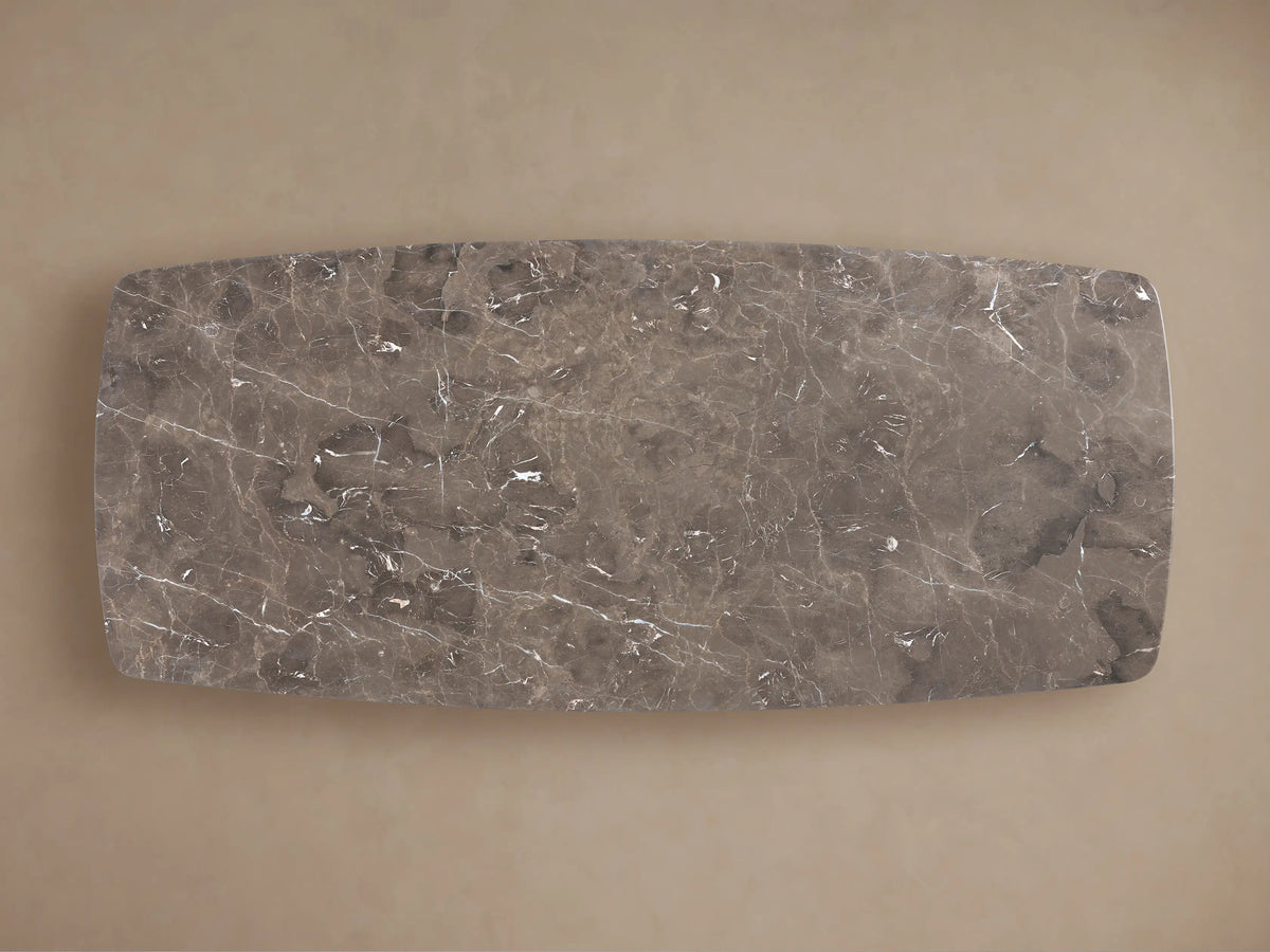 Close-up of Saint Germain Stone Dining Table's espresso brown stone top with white veining, dark mineral deposits, and rounded corner.