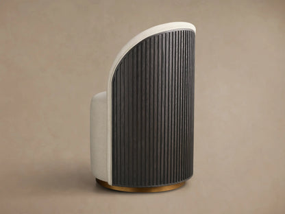 Side view of the Finnley Dining Side Chair, featuring a curved reeded Ebony back, cream upholstery, and brass plinth base.