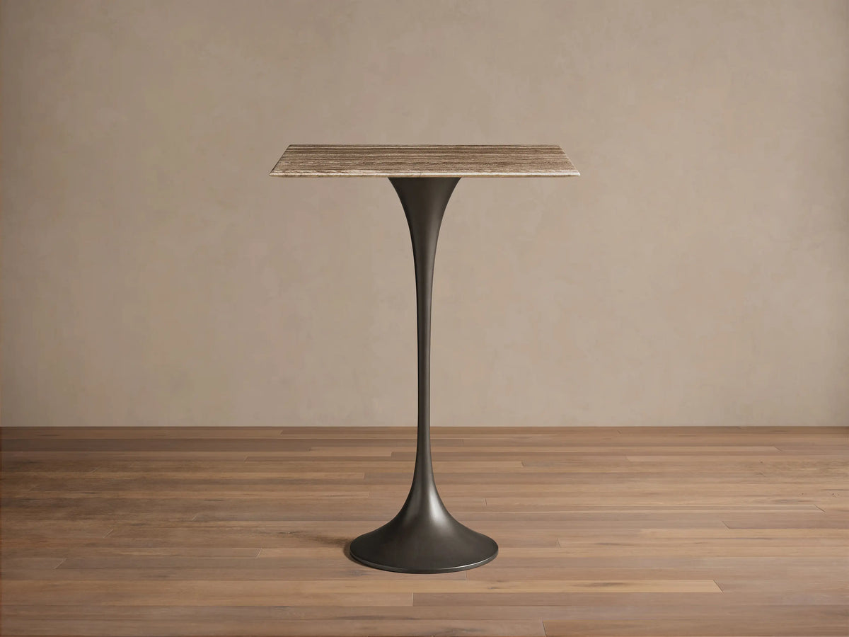 Front view of the Saint Germain Square Bar Table with a light woodgrain square top and a dark tapered pedestal base.