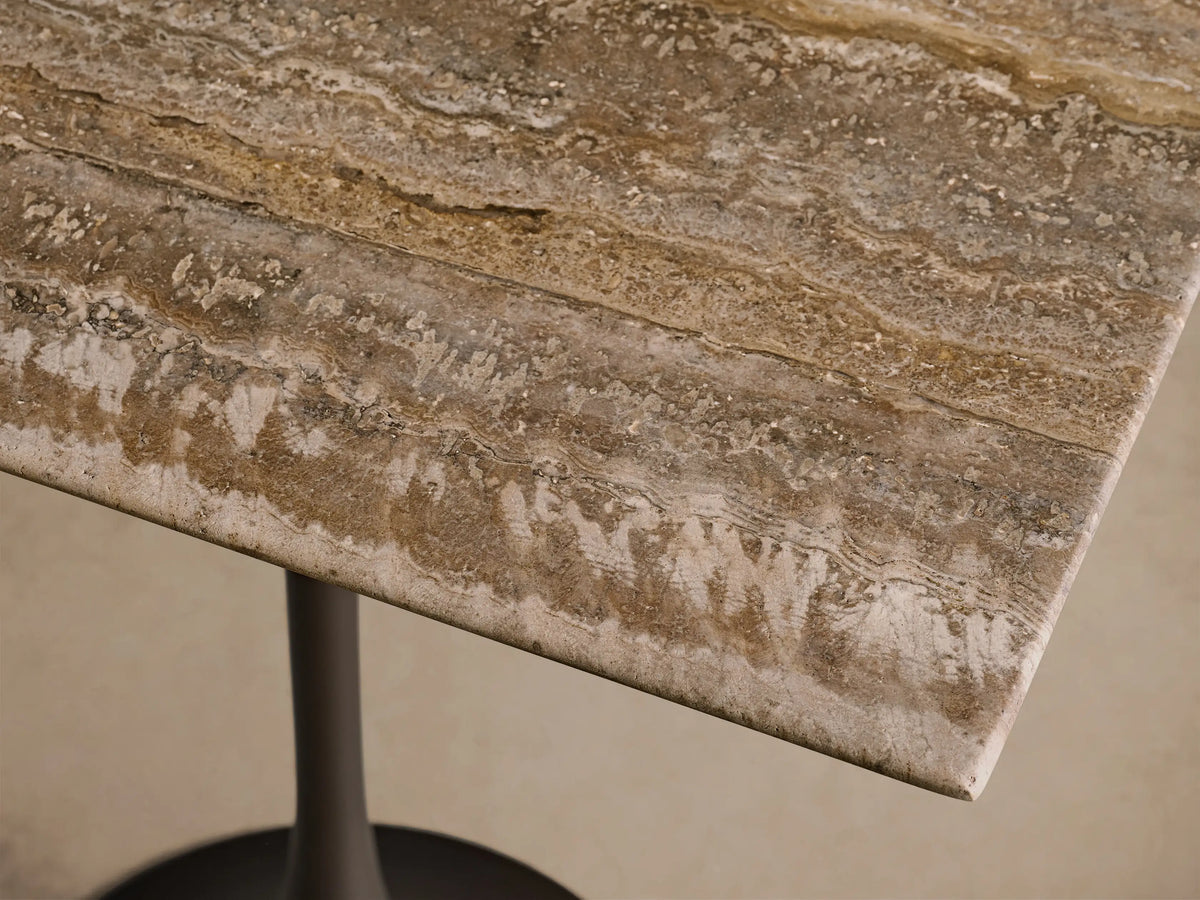 Front view of the Saint Germain Square Counter Table with a square brown and beige striped stone top and a dark bronze steel flared pedestal base.