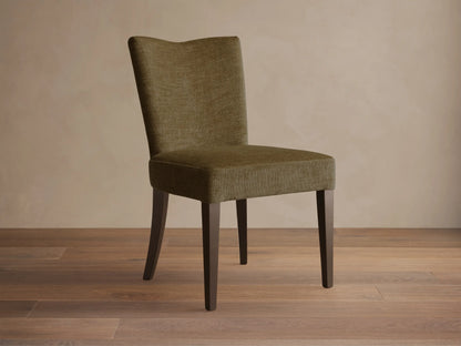 Front view of the olive textured Giovanni Dining Side Chair with a gently curved back and dark wood legs.