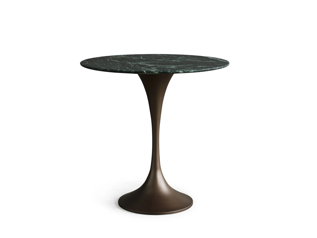 Saint Germain Bistro Table with a round green marble top featuring unique white veining patterns on a beige background.
