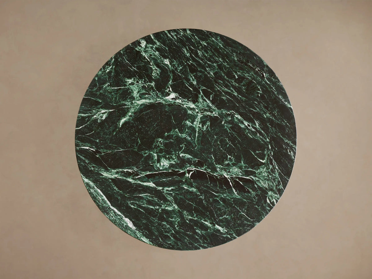 Saint Germain Bar Table with a polished green marble tabletop featuring white veining, supported by a sleek steel base.