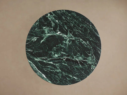 Saint Germain Counter Table with a smooth round green marble top featuring unique veining, set on a sleek steel base.