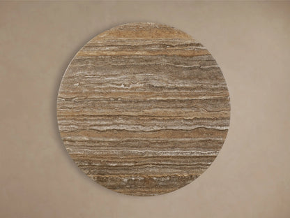 Close-up of the brown, beige, and white veined stone tabletop of the Saint Germain Round Stone Dining Table with Toulouse Base.