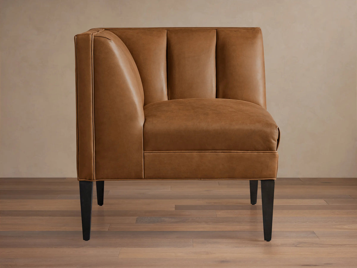 Gates Leather Corner sectional piece in warm brown recycled leather, featuring channel-stitched back and dark tapered legs.