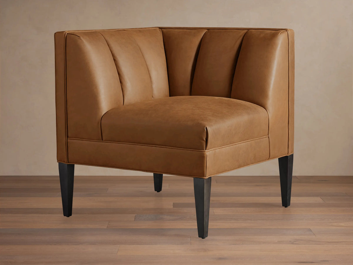 Gates Leather Corner sectional piece in warm brown recycled leather, featuring channel-stitched back and dark tapered legs.