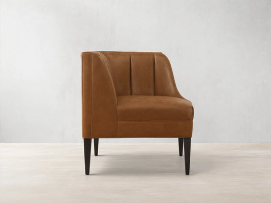Gates Leather Corner sectional piece in warm brown recycled leather, featuring channel-stitched back and dark tapered legs.