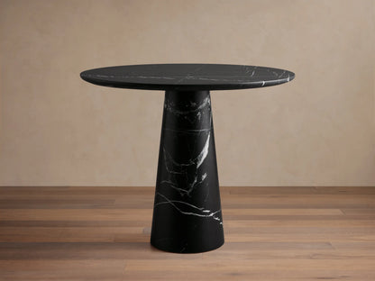 Front view of the Hemmings Bistro Table, a black marble table with a round top and conical base, featuring white veining.