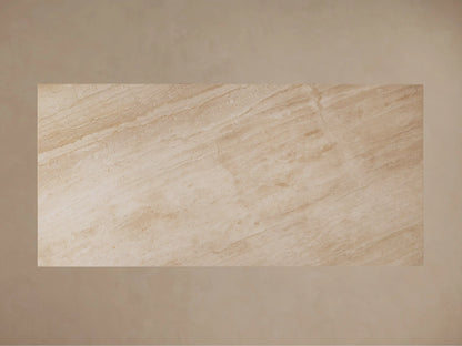 Ilaria Dining Table made from beige coralle marble, displaying natural streaks and patterns, with a smooth, honed surface.