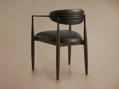 Jagger Faux Leather Dining Arm Chair in Cinder with a curved oil-rubbed bronze frame and rich dark brown faux leather seat and backrest.